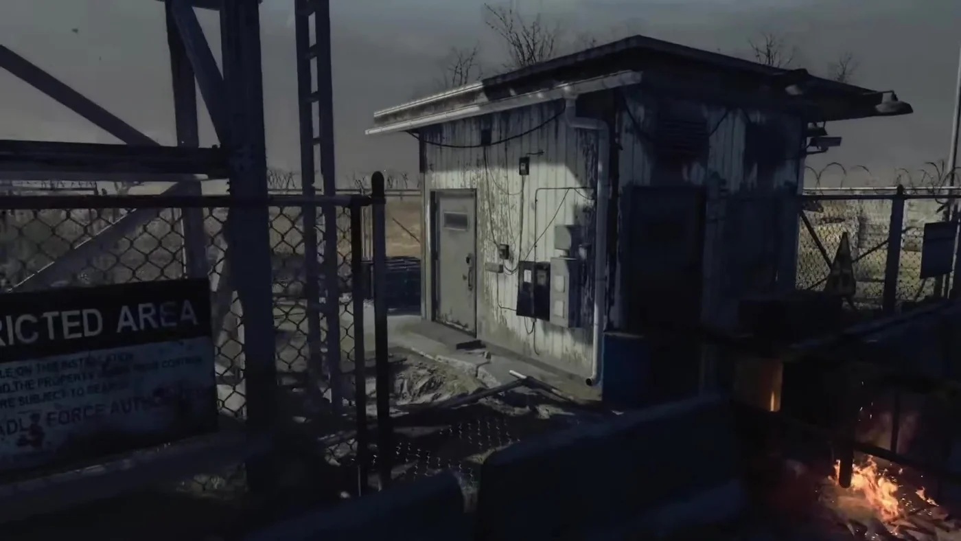 The white guard hut of the Security Checkpoint behind its fence and a Restricted Area sign, Alpha Omega, Call of Duty Black Ops 4 Zombies