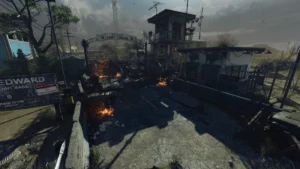 The Security Checkpoint seen from above, with the Welcome to Camp Edward gate, the watchtower and burning debris, Alpha Omega, Call of Duty Black Ops 4 Zombies