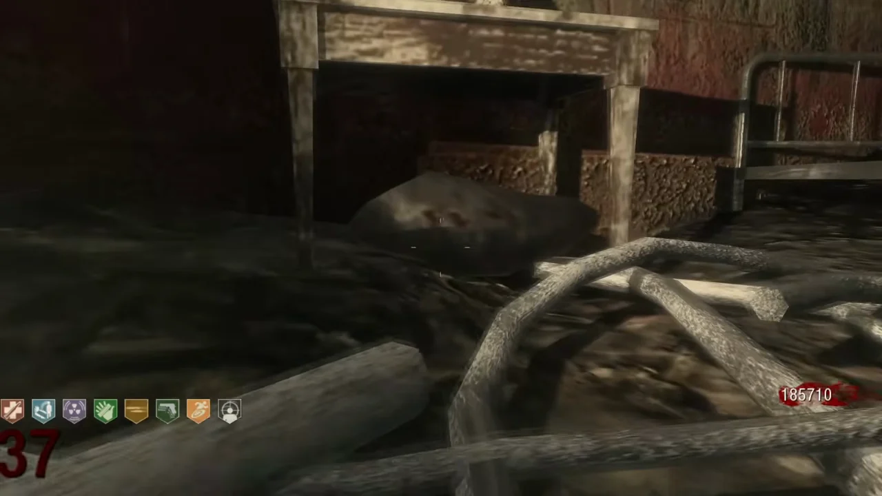 The meteorite on the floor under the small nightstand with a clock, next to an upturned bed, in Call of the Dead, Call of Duty Black Ops Zombies