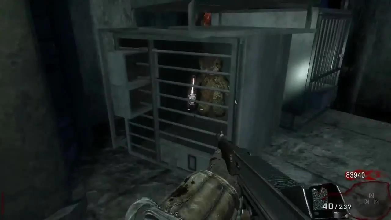 The teddy bear holding a Juggernog bottle and an upgraded M1911 in a cage, one of the Fly Trap objects in Der Riese, Call of Duty Black Ops Zombies