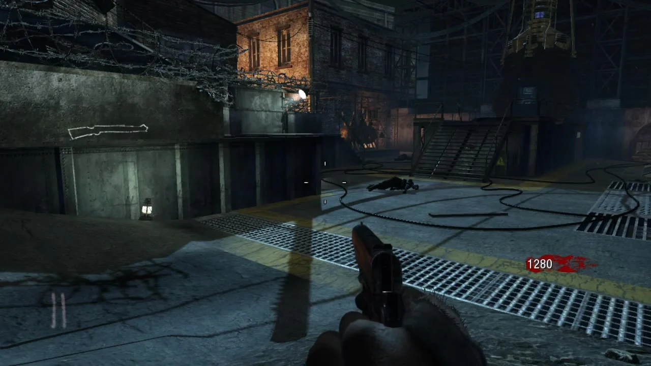 The starting courtyard of Der Riese, a rifle outline on the wall on the left, a staircase and the mainframe tower on the right, Call of Duty Black Ops Zombies