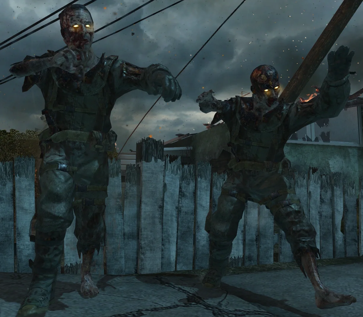 Two zombie soldiers with glowing yellow eyes behind a fence in Nuketown Zombies, Call of Duty Black Ops II Zombies