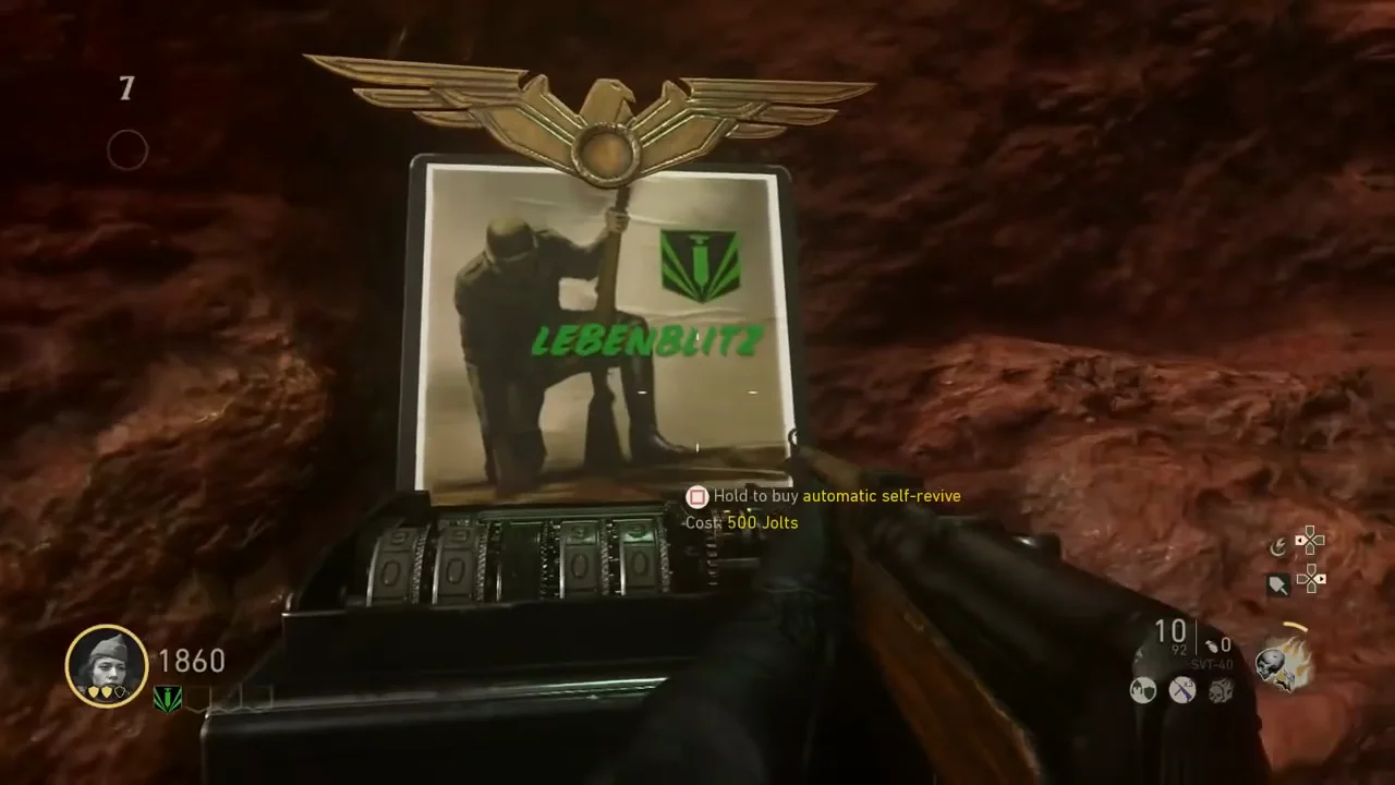 The Lebenblitz machine against the red rock of the beach, with the prompt to buy an automatic self-revive for 500 Jolts, The Darkest Shore, Call of Duty WWII Zombies