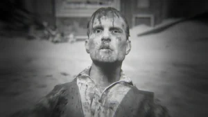 Klaus Fischer covered in blood in the snow of the village, black and white achievement image of Dark Reunion, The Final Reich, Call of Duty WWII Zombies