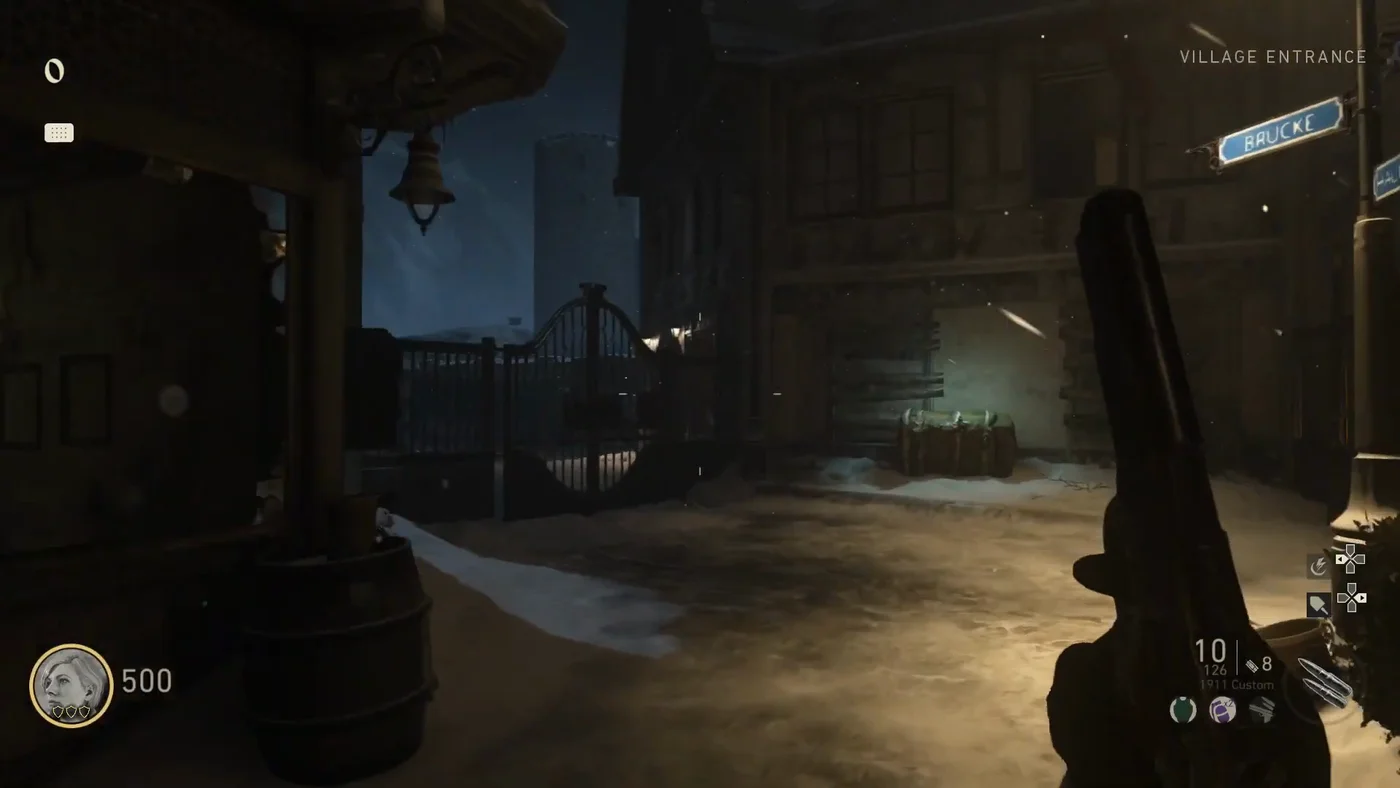 The iron gate towards the bridge and the castle tower, with a green trunk against a boarded door, Village Entrance, The Final Reich, Call of Duty WWII Zombies