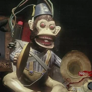 The Monkey Bomb held in first person, a cymbal monkey in a fez, Call of Duty Black Ops Zombies